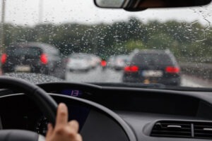 A group of cars driving in rainy weather. A lawyer can give you safety tips for driving in the rain.