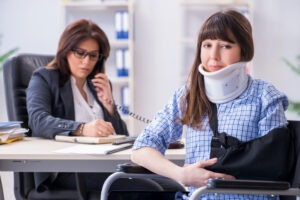 A woman in a wheelchair talks to a Fresno catastrophic injury lawyer.