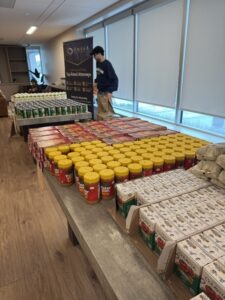 Omega Law Group and PATH volunteers are working hard on the meal kits